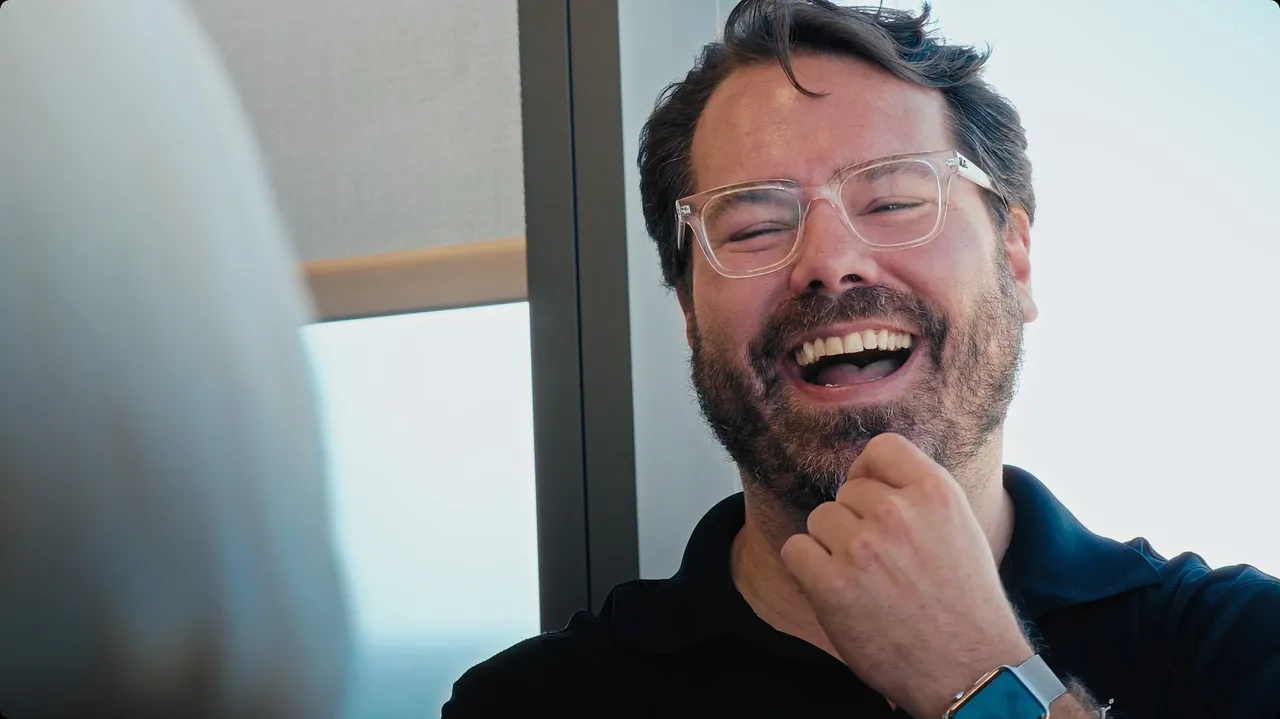 Customer laughing naturally during a video interview